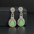 Green carved stone earrings by Kurti Connection USA